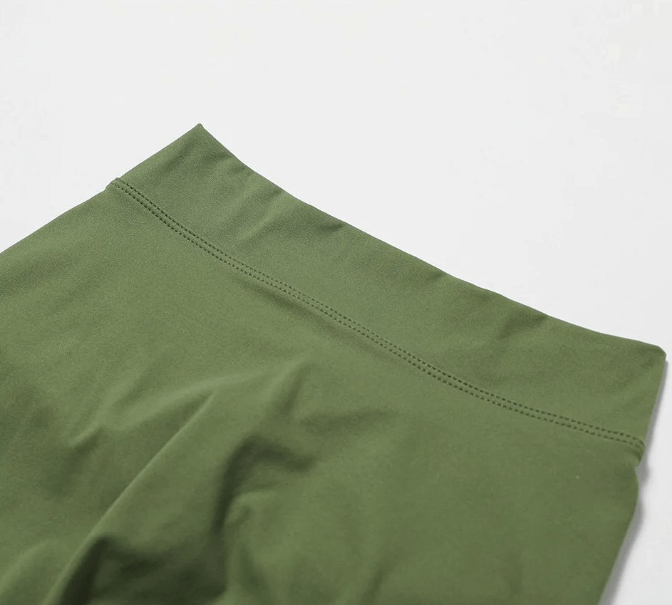 Close-up of green women's elastic performance yoga shorts, SF2209, made of durable nylon and spandex, perfect for active wear.